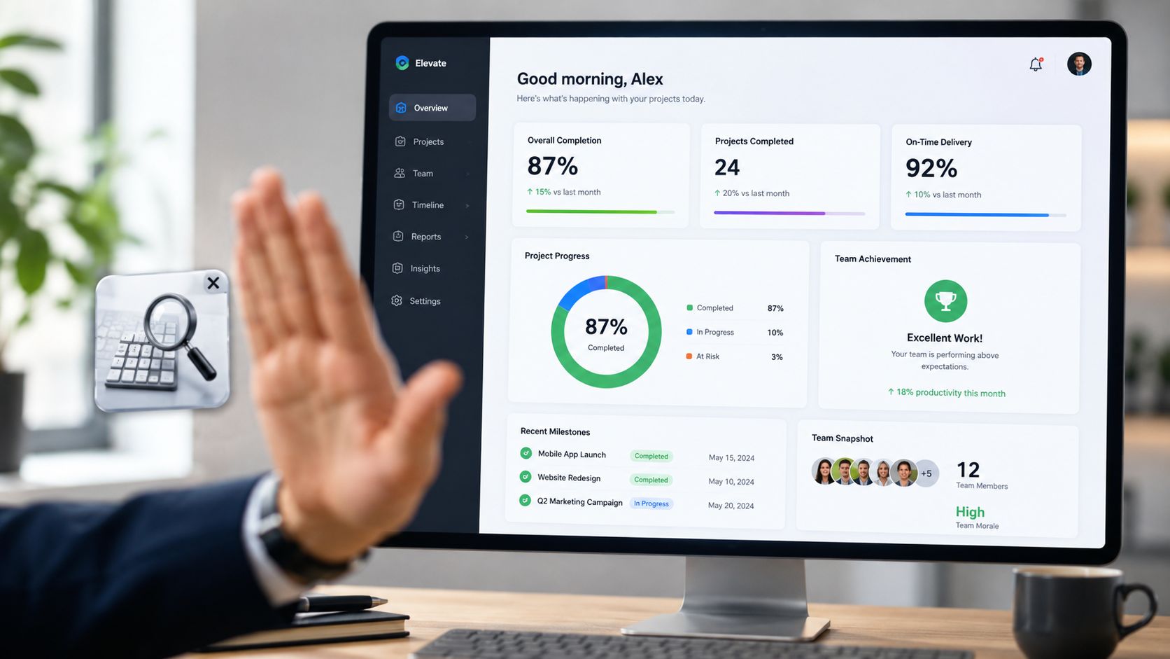 A professional hand makes a stop gesture in front of a computer screen displaying project management analytics.